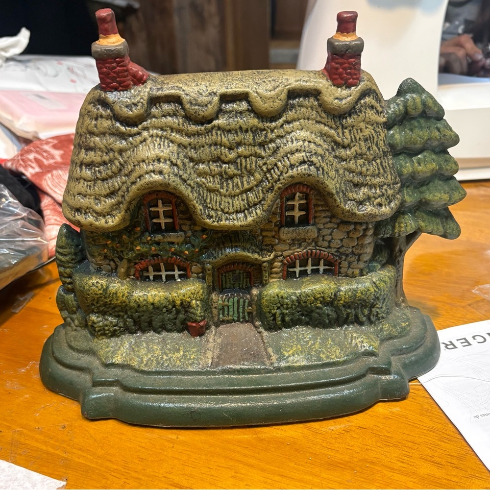 English cottage doorstop heavy cast iron hand-painted thatched roof design